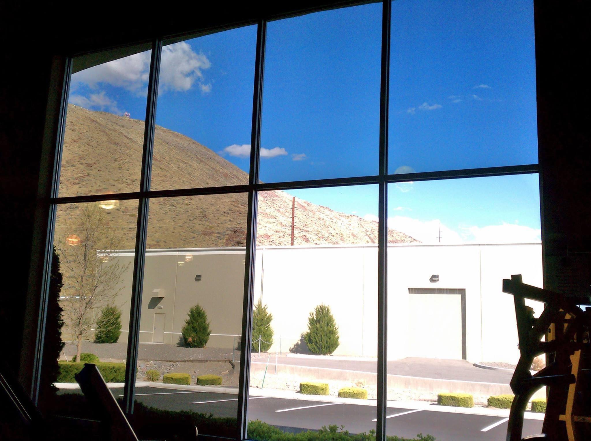 Commercial solar control window film reducing heat and glare on business windows