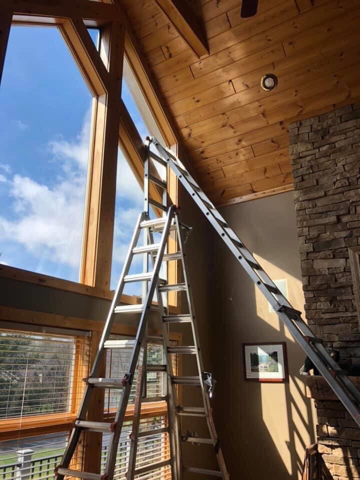 Solar control film on two-story architectural windows in a Delaware home
